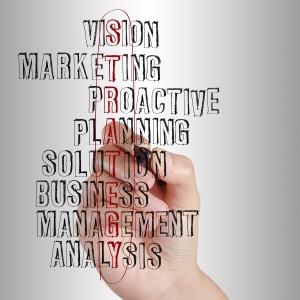 business man writing business strategy